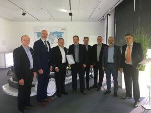 Appointment as Key Supplier 2019 at this year's strategy meeting at Brose in Bamberg. From left to right: Erik Wirsing (VP Global Innovations, DB Schenker), Claus Freydag (Head of Ocean Freight DE / CH DB Schenker), Periklis Nassios (Managing Director Purchasing Brose Group), Hartmut Eckardt (Key Account Manager for Business Development Automotive, DB Schenker), Roland Dressler (Head of Air Freight DE / CH DB Schenker), Achim Brückner (Head of Purchasing Investments & Services Brose Group), Harald Scheler (Head of Coburg & Nuremberg, DB Schenker), Wolfgang Krebs (Head of Logistics Brose Group). Image © Brose Group.